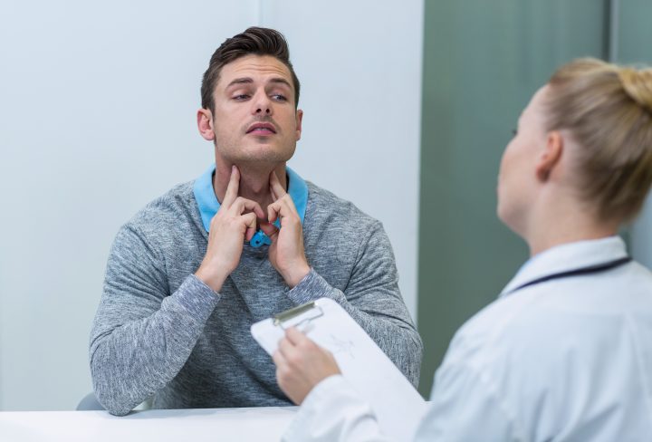 Patient discussing his problem with female patient in clinic